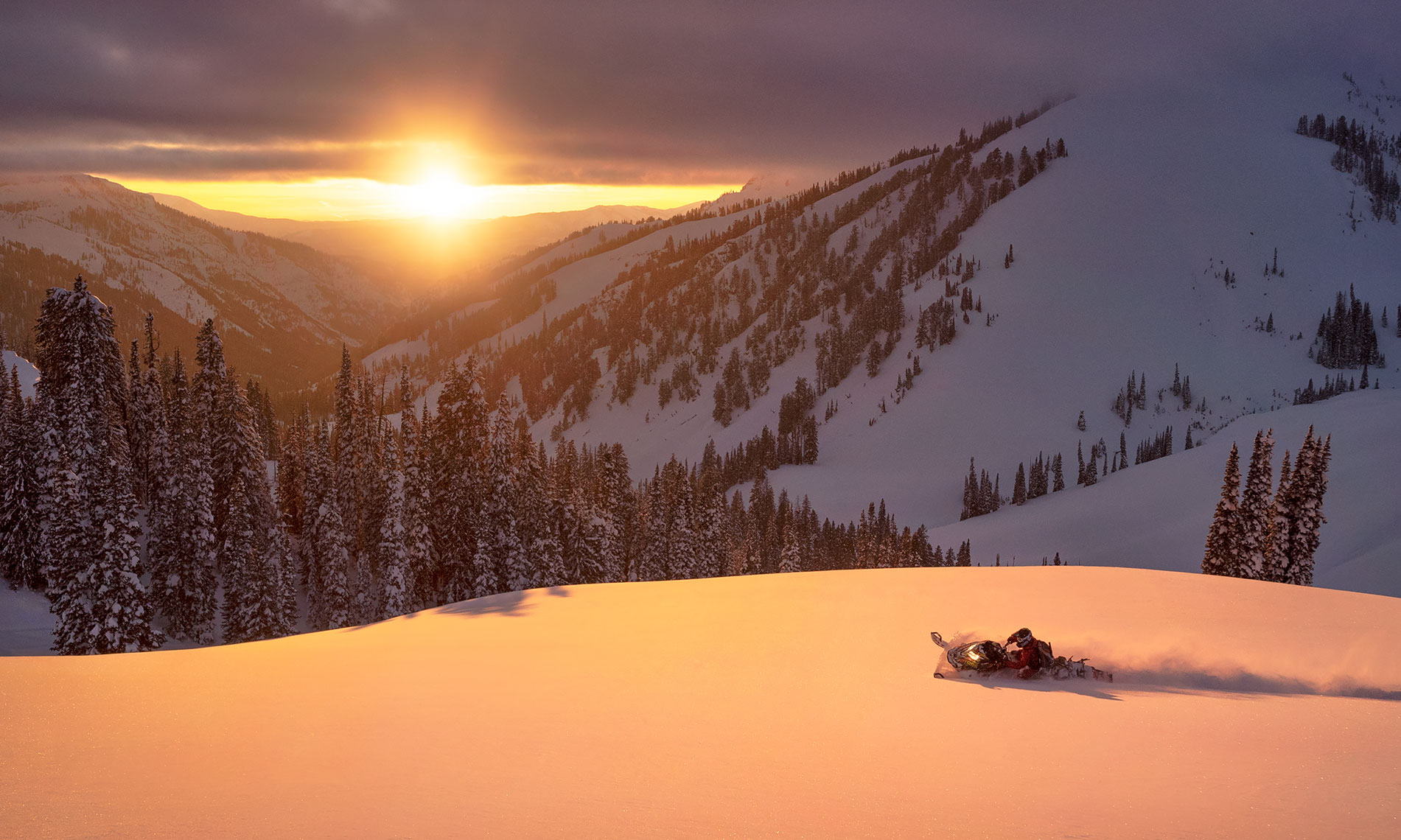snowmobile_mountain_sunset